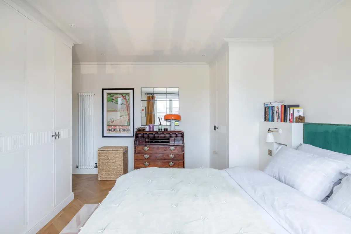 A Beautiful Duplex Apartment in a Notting Hill Townhouse 14 white bedroom built in wardrobes green headboard