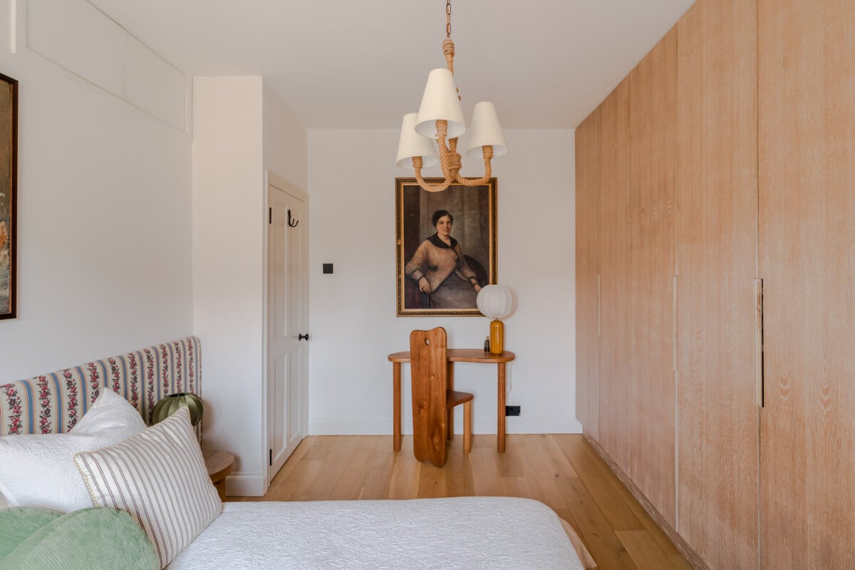 Cozy Contemporary Spaces in a Light-Filled Victorian Apartment 19 white bedroom floor to ceiling wardrobes small desk