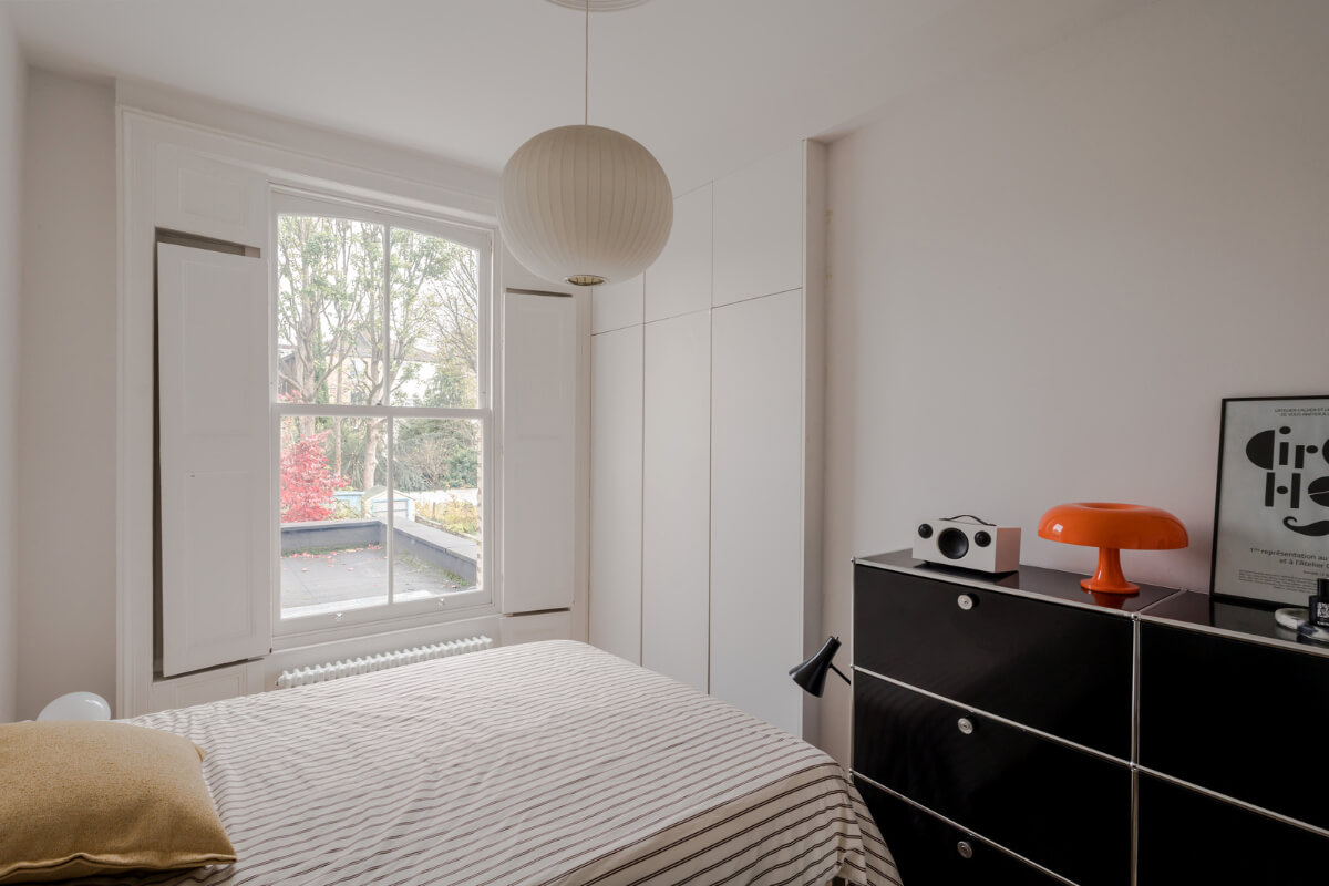 A Modern Apartment in a London Victorian House 17 white bedroom floor to ceiling wardrobes
