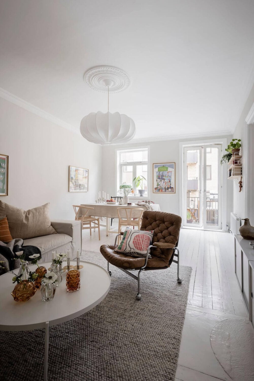 White-Painted Floorboards in a Turn-of-the-Century Apartment 6 white floorboards bright scandi living room