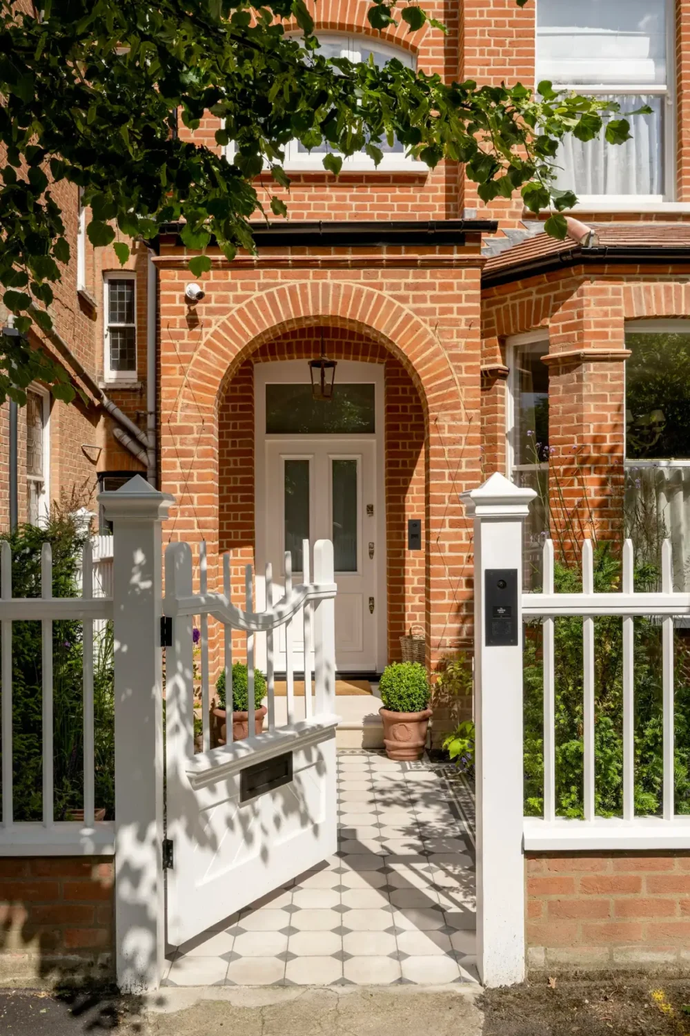 A Timeless Energy-Efficient Victorian Townhouse in Bedford Park 24 white gate entry victorian townhouse