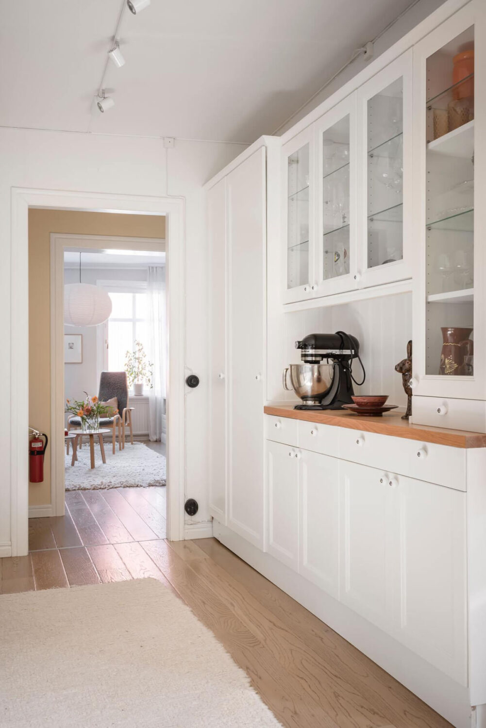 Bright Rooms with Light Color Tones in a Swedish Apartment 16 white kitchen cabinets glass fronts