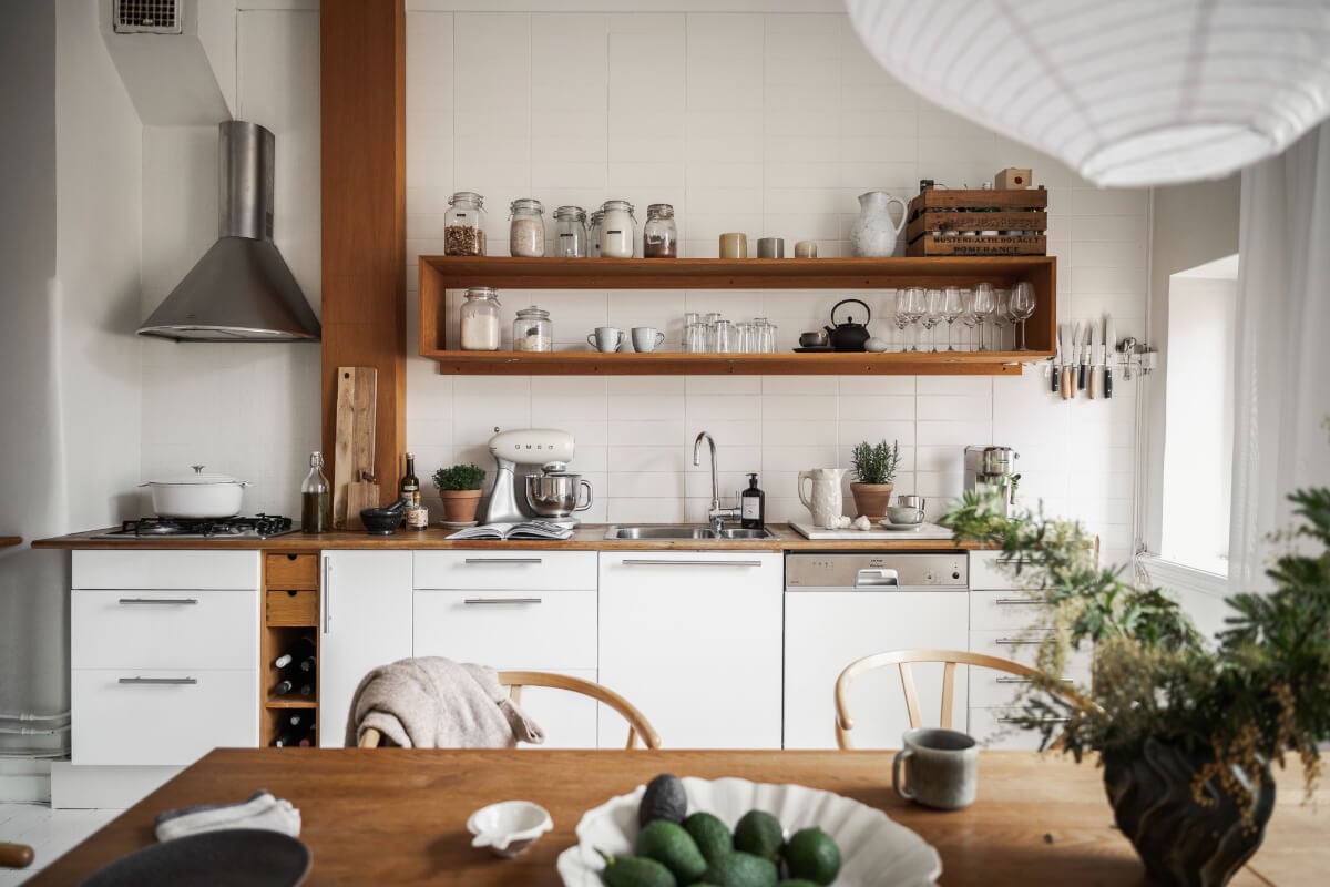 A Stylish Studio Apartment with Period Features and Large Windows 18 white kitchen wooden countertop shelves