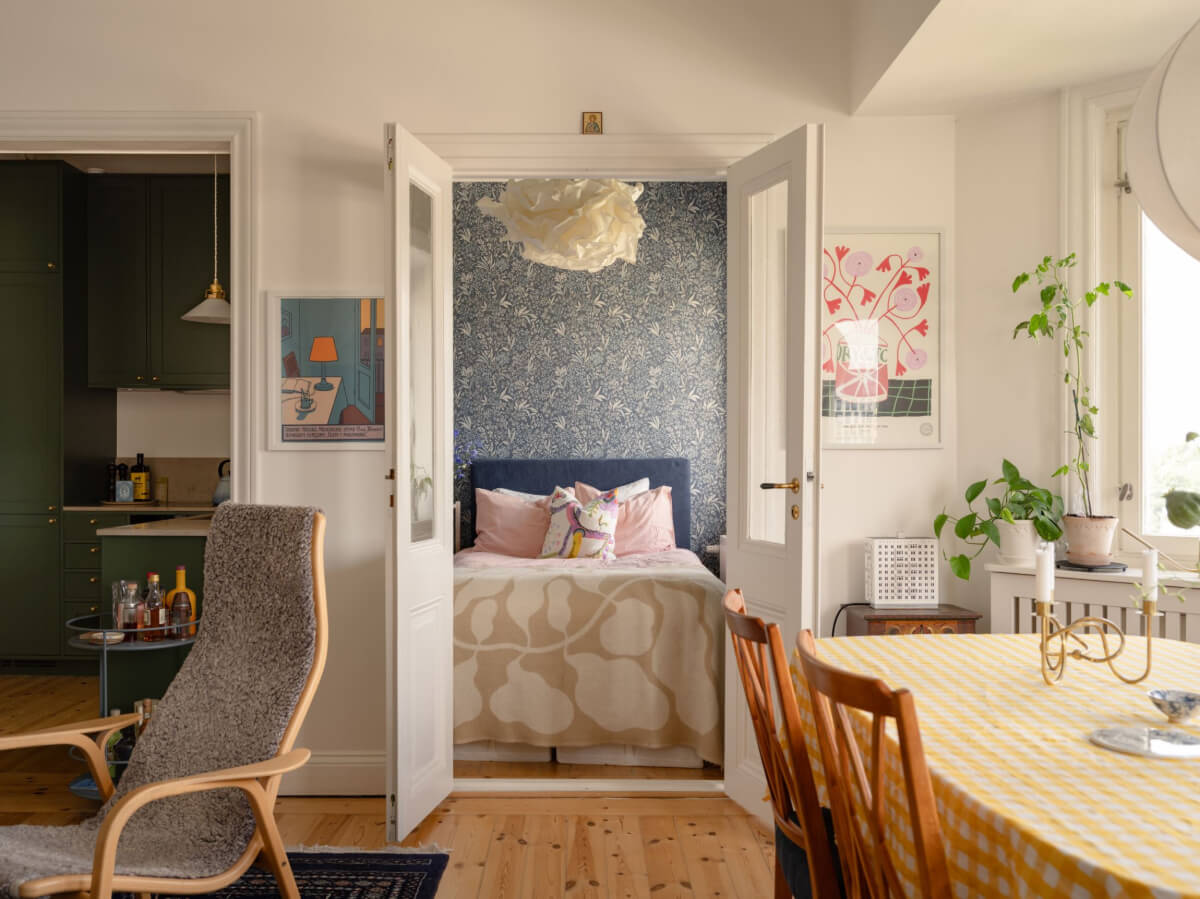 A Small Apartment with High Ceilings and a Large Bay Window 15 white living room double doors to tiny bedroom