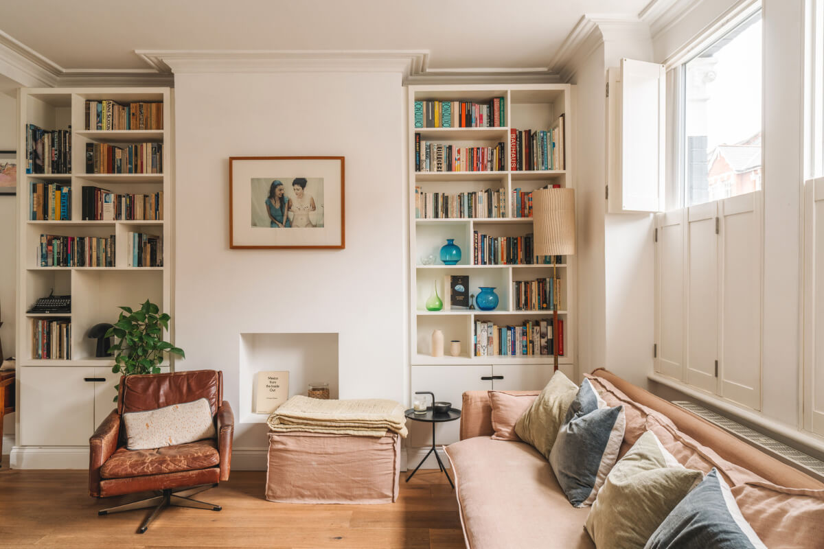 A Charming Light Edwardian House with a Tiny Garden 2 white living room window shutters