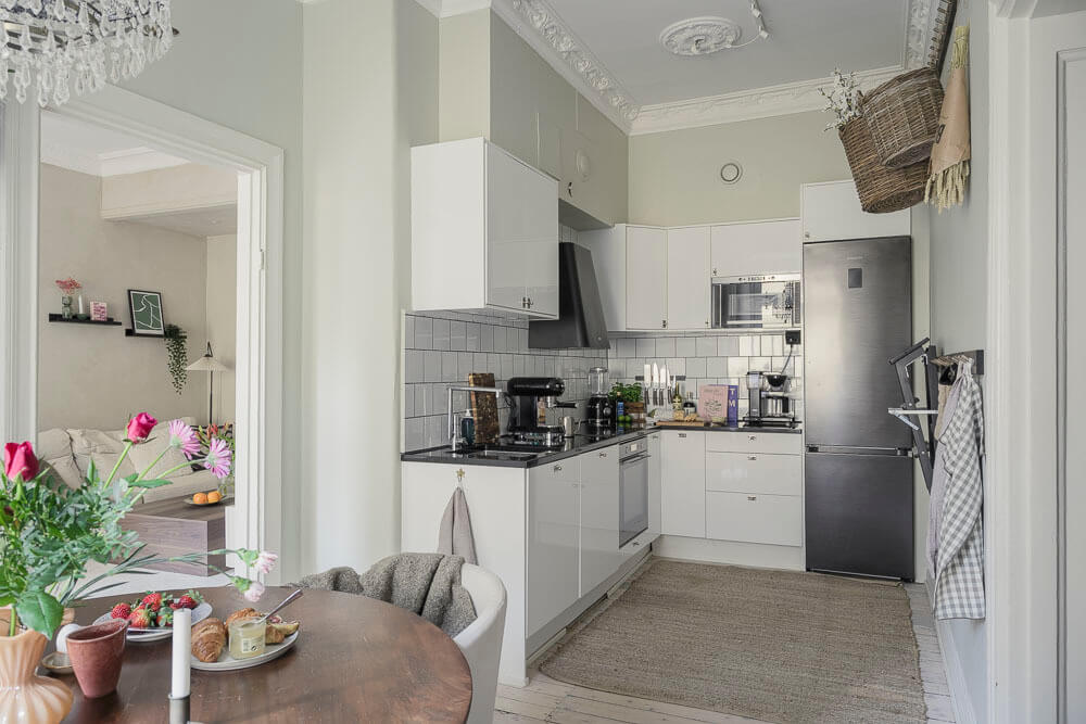 Limewash Wall and Period Features in a Swedish Apartment 8 white modern kitchen in historic apartment with period features