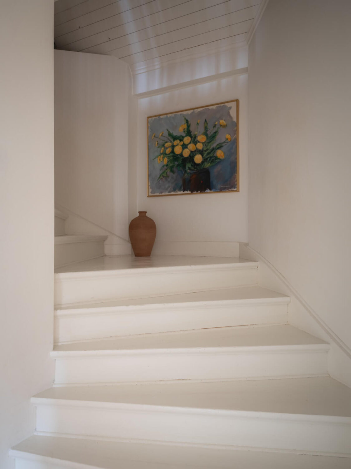 A Renovated Duplex Apartment with Exposed Brick Walls 14 white painted staircase