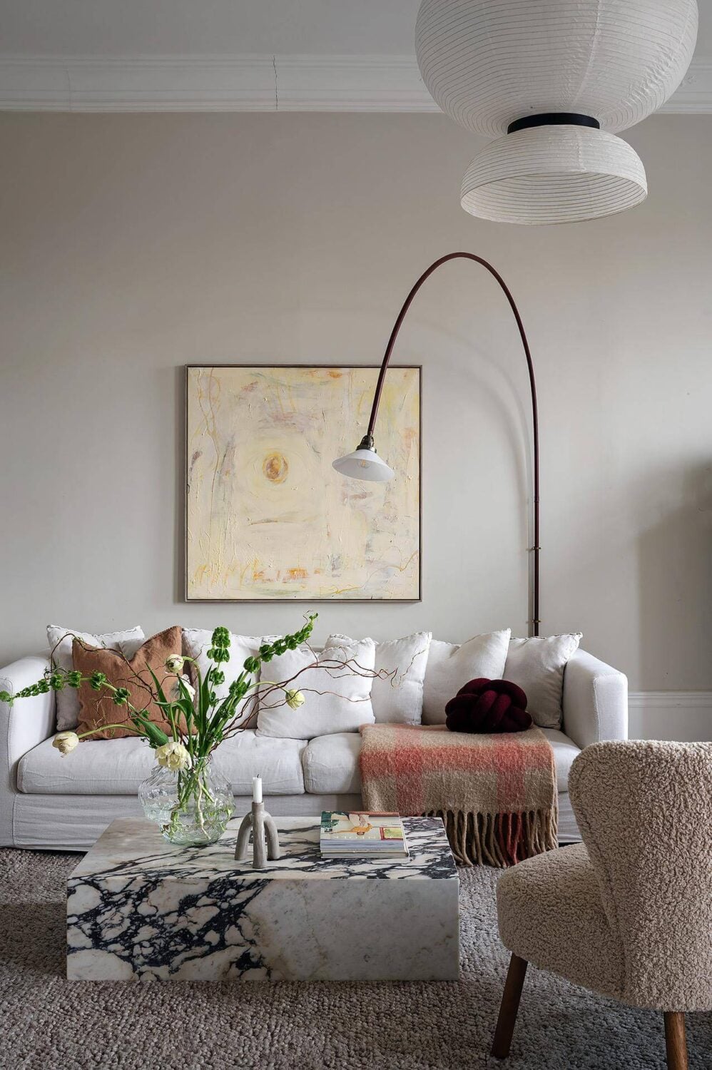 Period Features and Modern Materials in a Swedish Apartment 3 white sofa arched wall lamp
