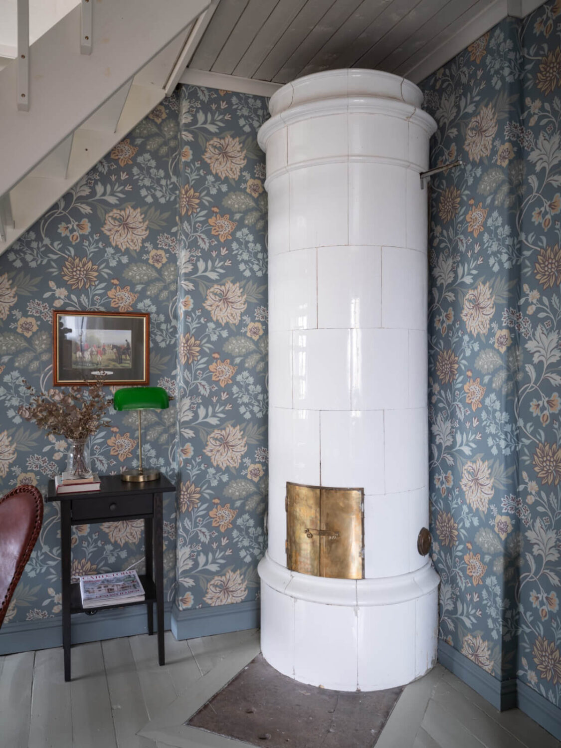 A Carefully Renovated Family Home in Sweden 4 white tiled fireplace