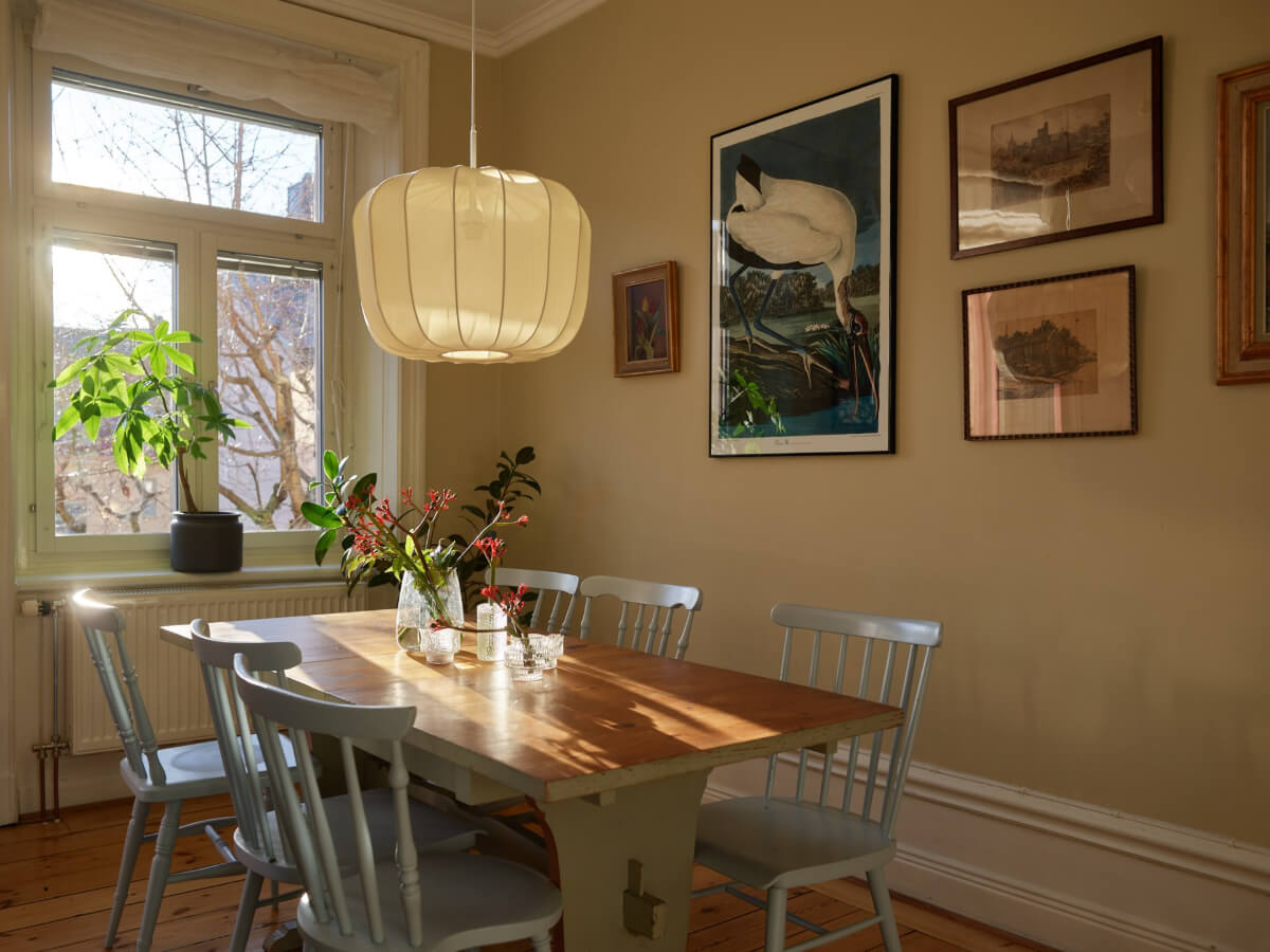 A Charming Historic Stockholm Apartment with a Blue Kitchen 11 wooden dining table blue chairs