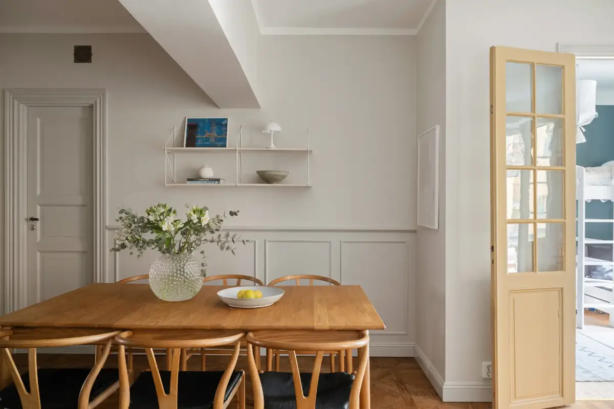 A Charming Ground Floor Family Apartment in Stockholm 4 wooden dining table wishbone chairs