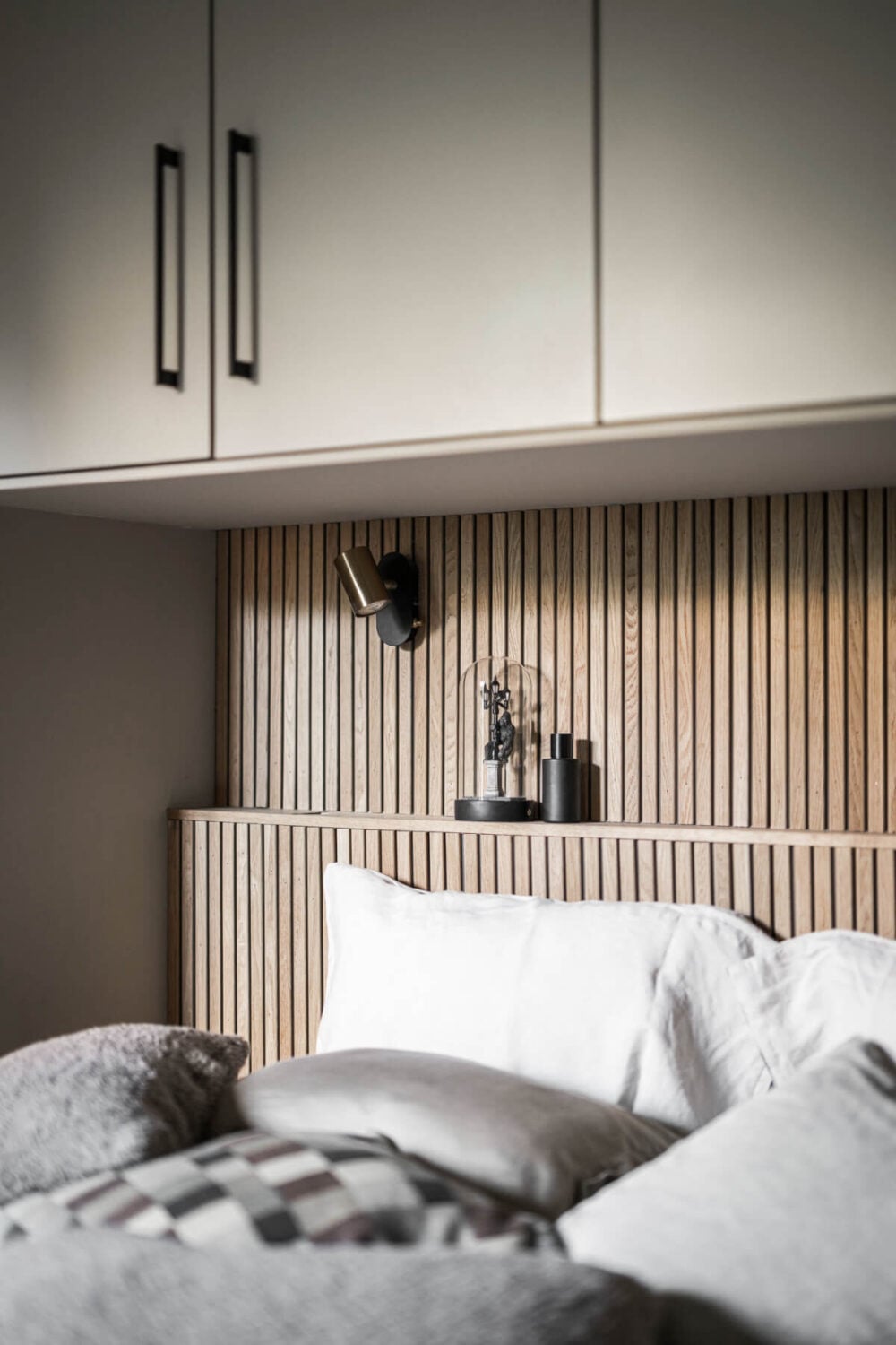 A Swedish Apartment with Exclusive Materials and Monochrome Color Scheme 19 wooden headboard with ledge