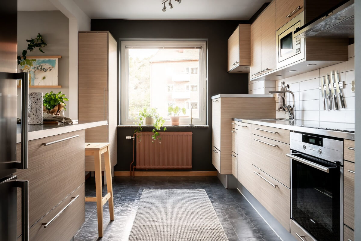 A Charming Apartment with Large Windows and Colorful Bedrooms 11 wooden kitchen black floor large window