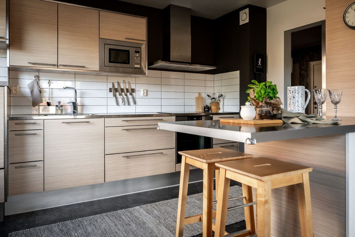 A Charming Apartment with Large Windows and Colorful Bedrooms 10 wooden kitchen breakfast bar