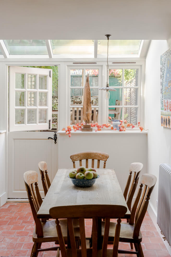 A Carefully Selected Color Palette in an 18th-Century English Cottage 8 wooden kitchen table and stone floor