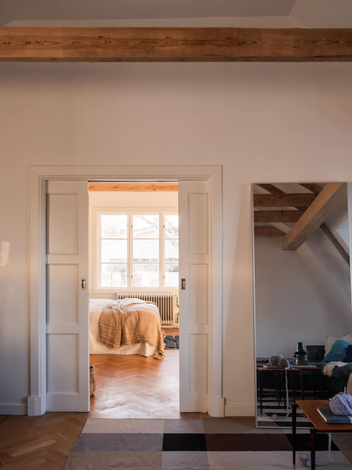 Painted Floorboards in a Unique Family Home in Sweden 19 wooden sliding doors