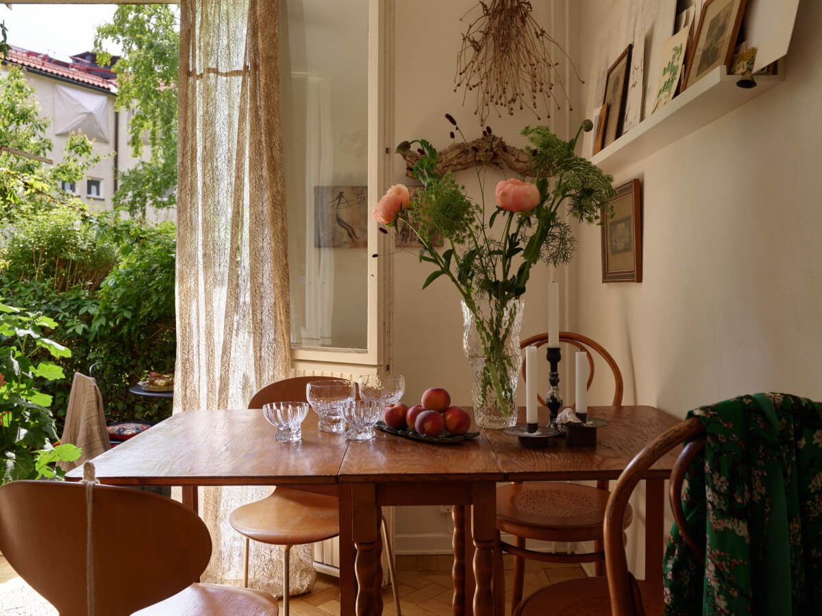 A Small Vintage Apartment with a Tiny Green Patio Garden 5 wooden table