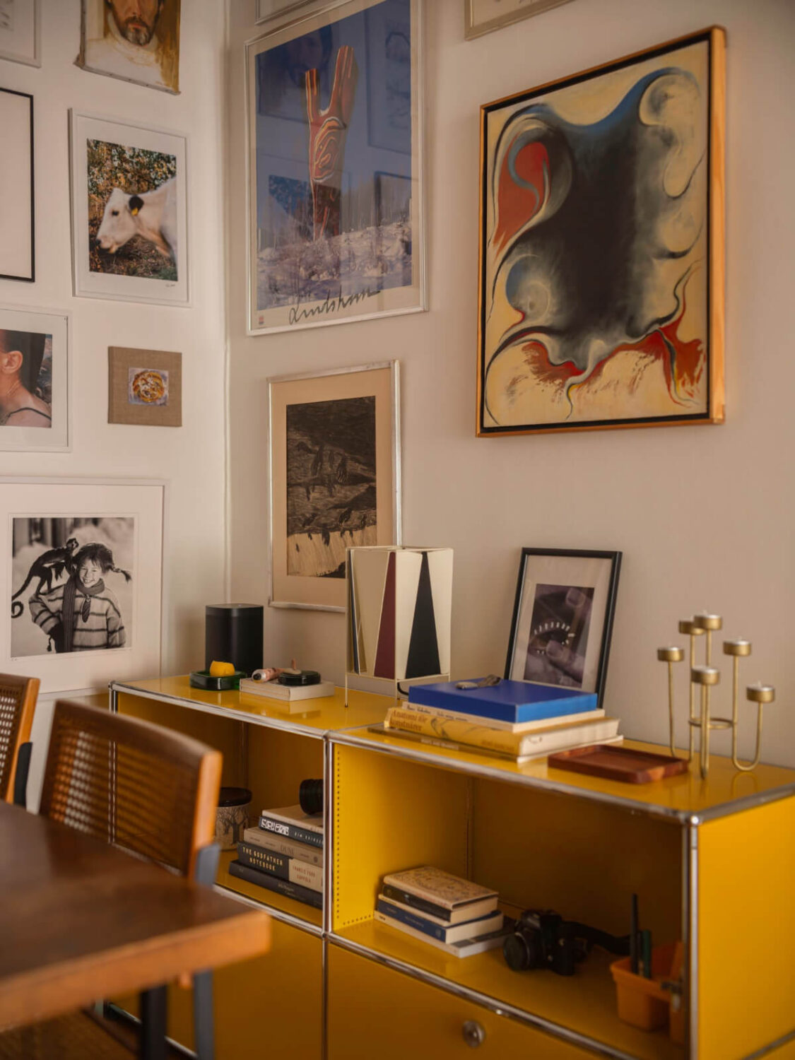 An Airy One-Bedroom Apartment with Art and A Yellow Kitchen 14 yellow cabinets