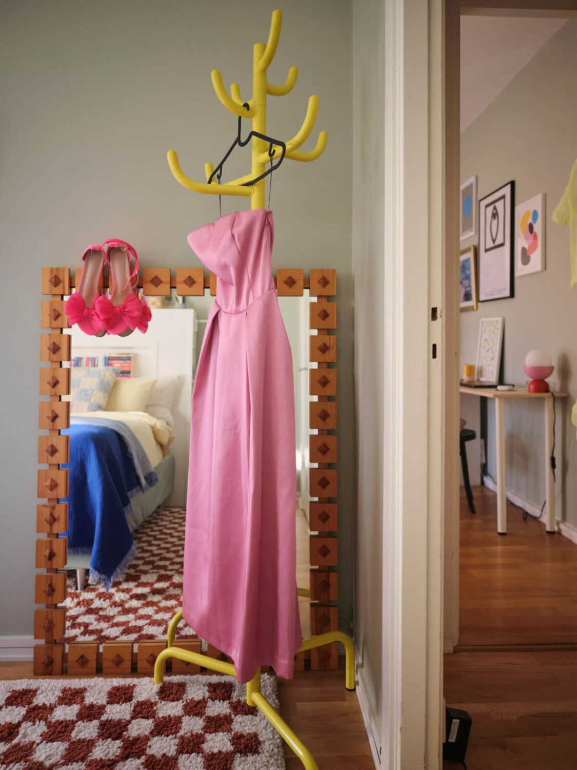 A Midcentury Swedish Apartment with Bright Color Accents 17 yellow coat hanger