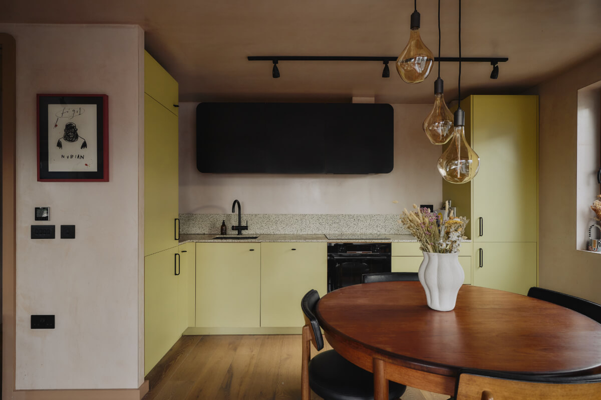 An Elegant Apartment with Plaster Walls and a Winter Garden 8 yellow-green kitchen cabinets
