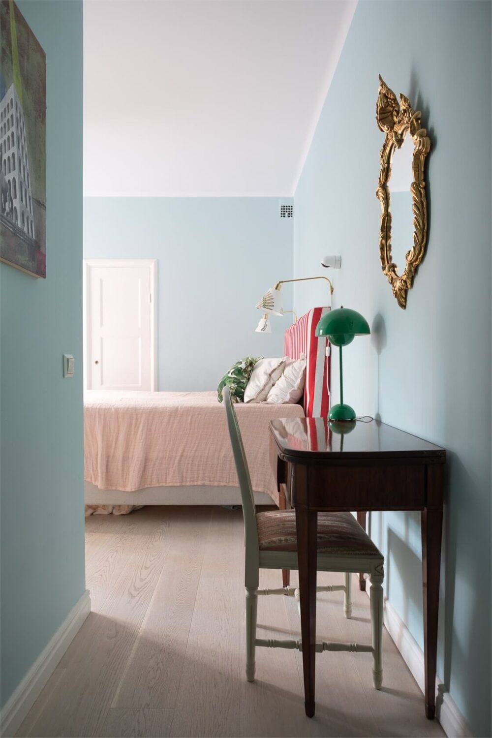 A Colorful Basement Duplex Apartment in Stockholm 18 antique desk light blue bedroom