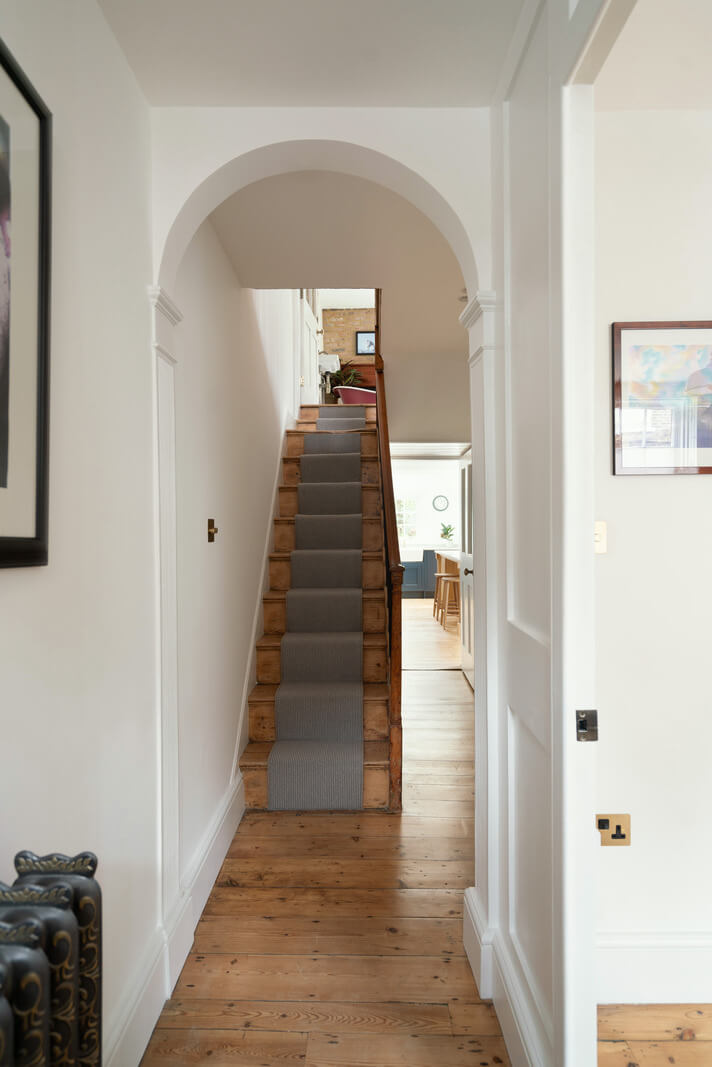 A Renovated Georgian House with an Extended Kitchen 15 arched doorway rustic floorboards
