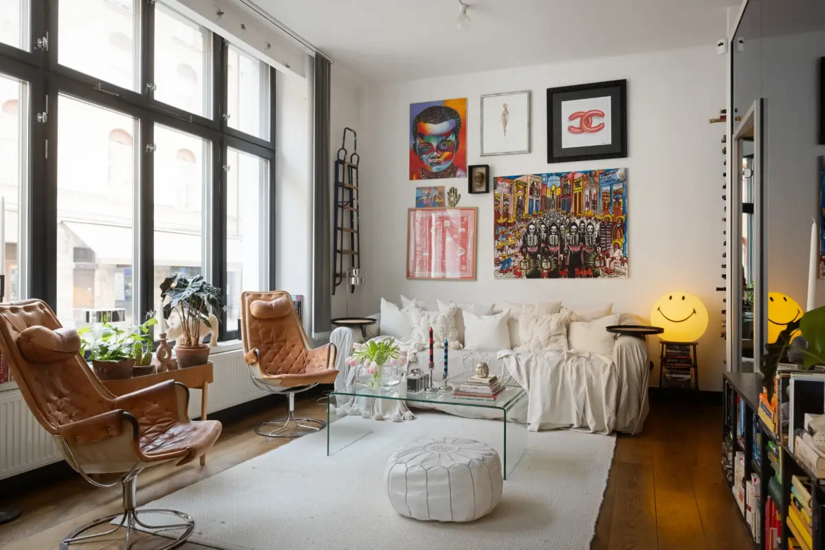 An Apartment with a Mirror Wall in a Former Stockholm Factory 5 art filled living room