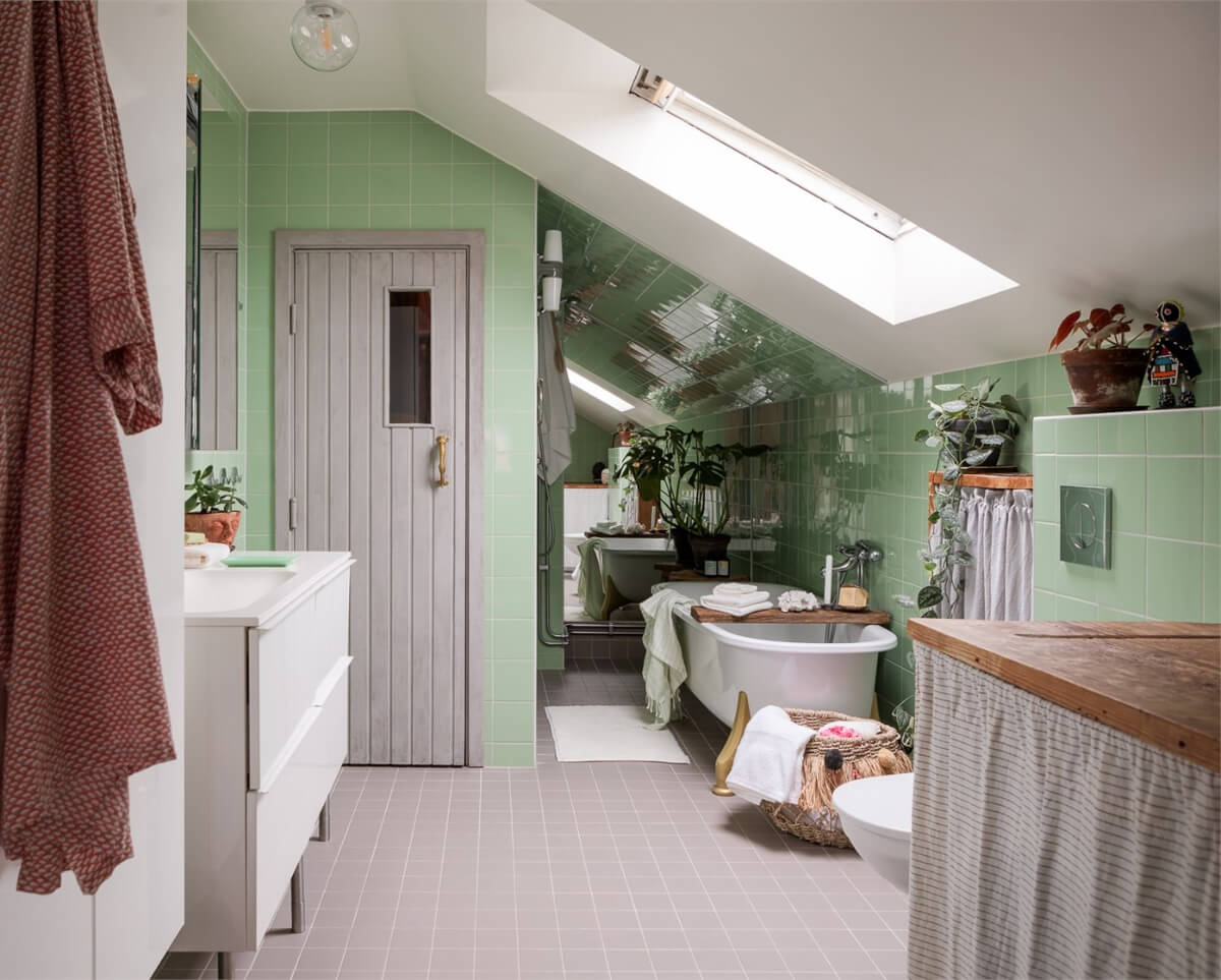 A Colorful Family Attic Apartment in Stockholm 30 attic bathroom green tiles