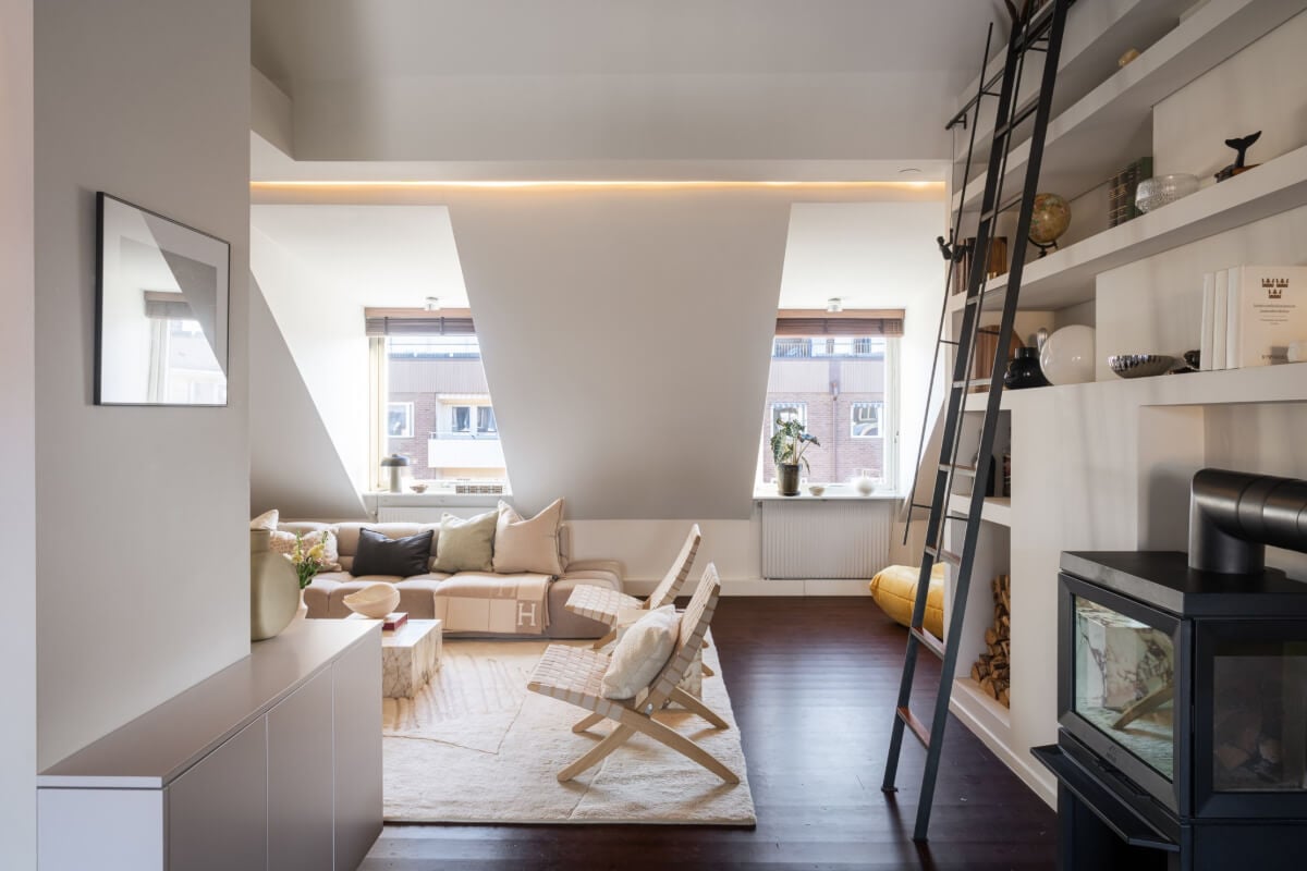 A Light Penthouse Apartment with Built-In Bookshelves 8 attic living room bookshelves