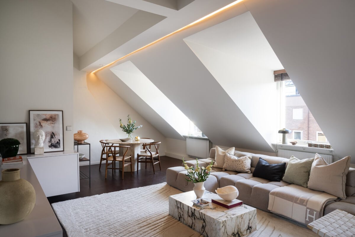 A Light Penthouse Apartment with Built-In Bookshelves 3 attic living room marble coffee table