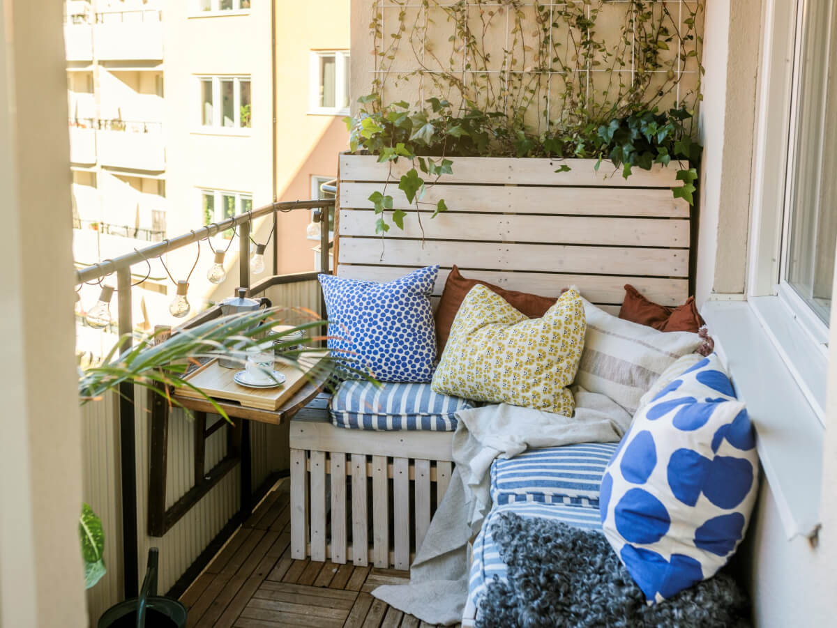 Cozy Plant-Filled Interiors in a 1940s Apartment 6 balcony corner bench