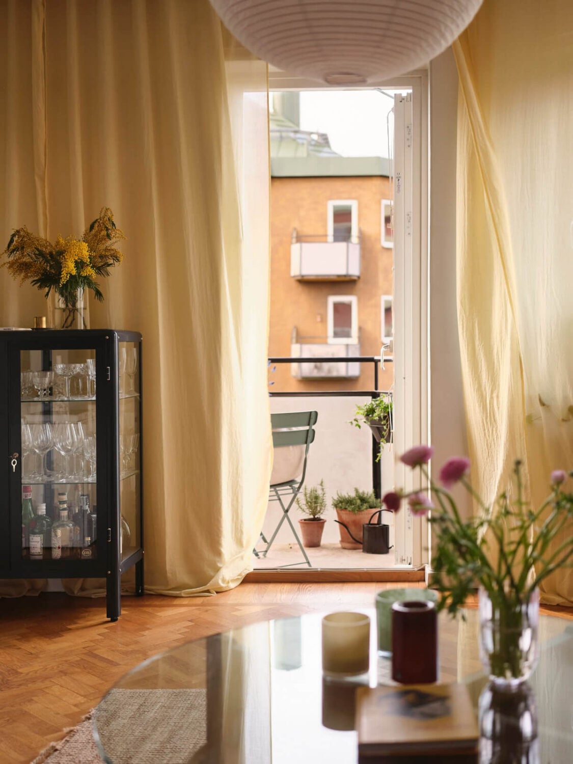 A Light Corner Apartment with Yellow Color Accents 10 balcony door yellow curtains