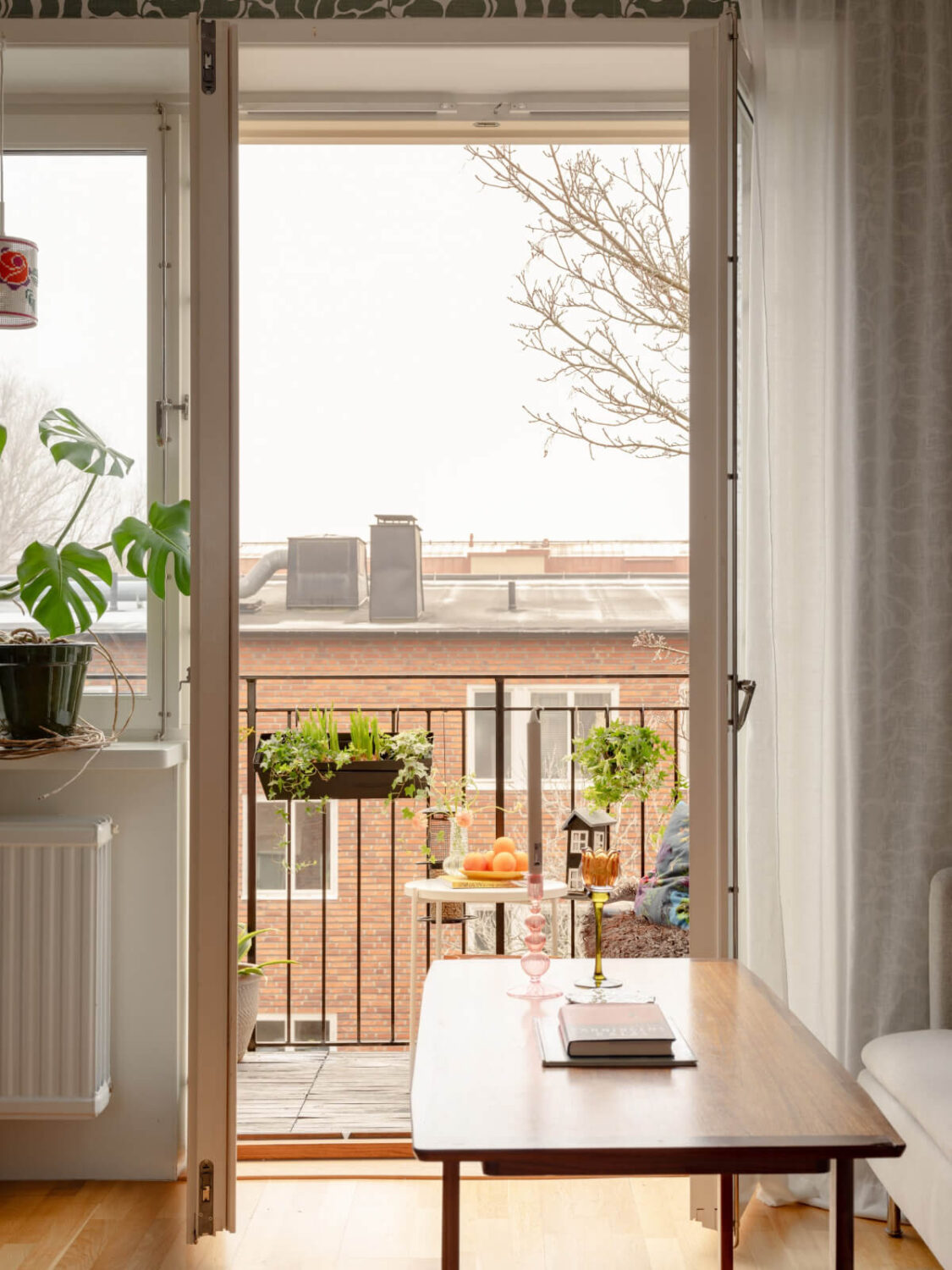 Colorful Wallpapers in a Well-Planned 1940s Apartment 6 balcony doors
