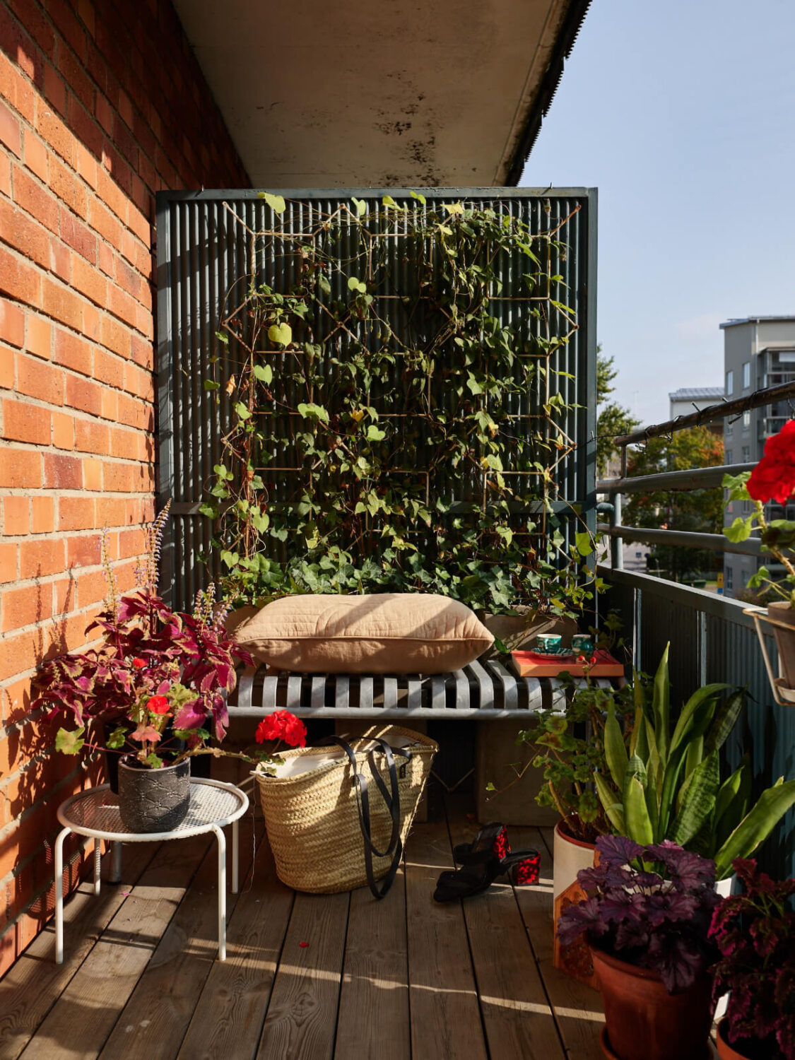 A Lovely Color Palette in a Midcentury Apartment in Sweden 6 balcony with plants