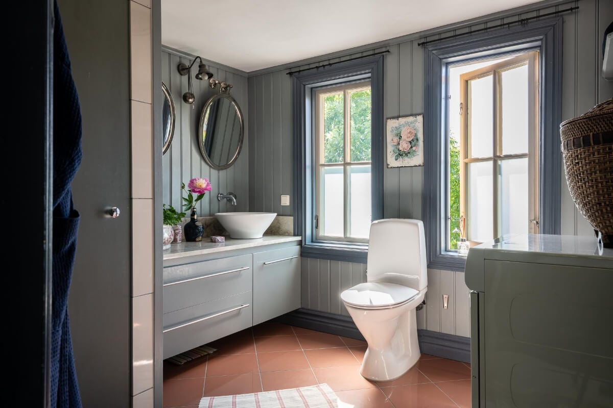 A Beautiful Historic Swedish Country House with Wallpapers 34 bathroom blue-gray wood paneled walls