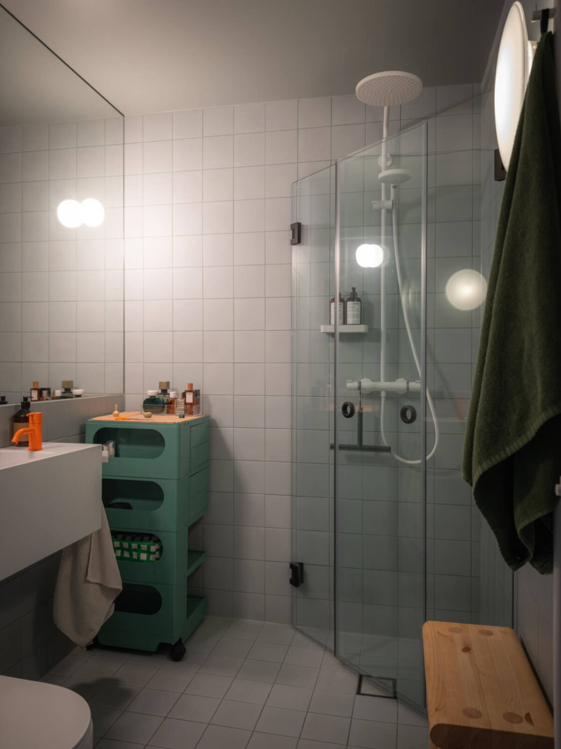 A Design Apartment in an Early 20th Century Building 25 bathroom green rolling cabinet A Design Apartment in an Early 20th Century Building