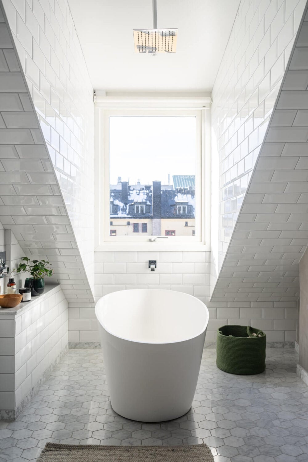 A Light Penthouse Apartment with Built-In Bookshelves 19 bathroom marble floor tiles freestanding bath