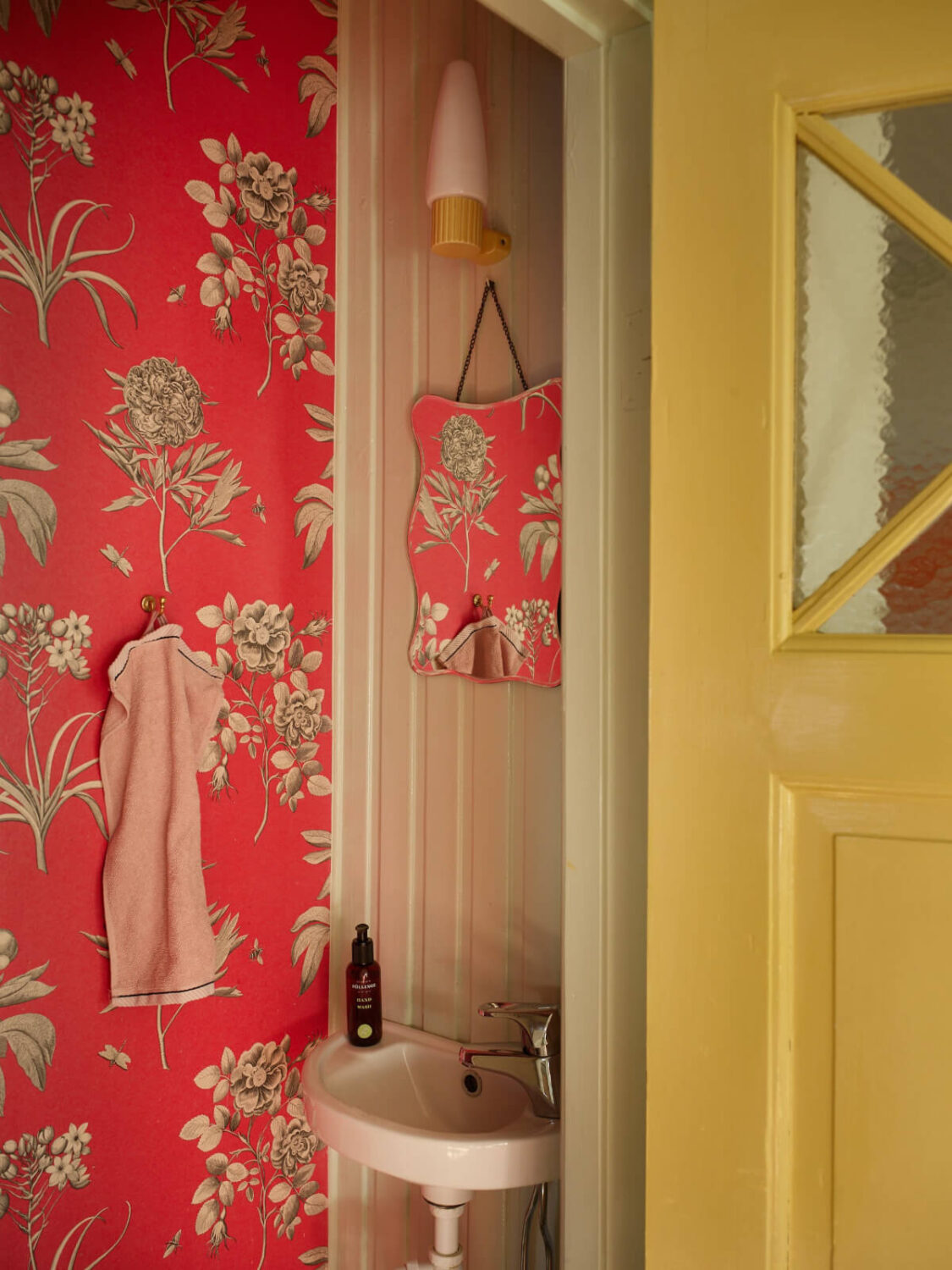 Colorful Interiors in a Wonderful Early 20th Century Swedish Villa 35 bathroom orange wallpaper
