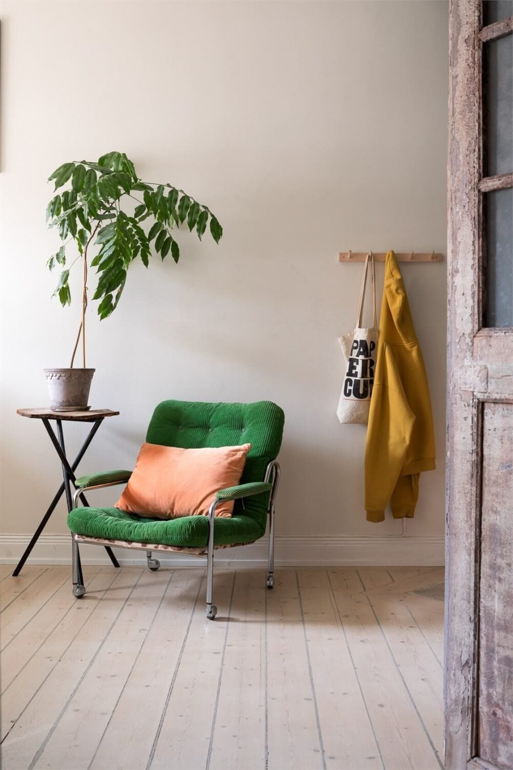 A Colorful Family Attic Apartment in Stockholm 37 bedroom detail green chair