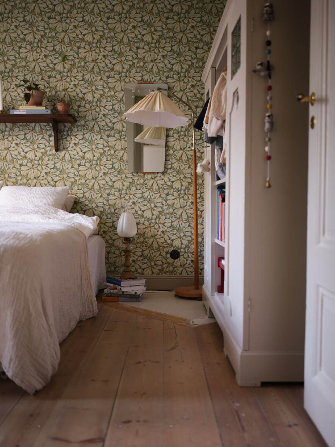 A Charming Vintage Apartment with Historic Wallpapers in Stockholm 14 bedroom green wallpaper