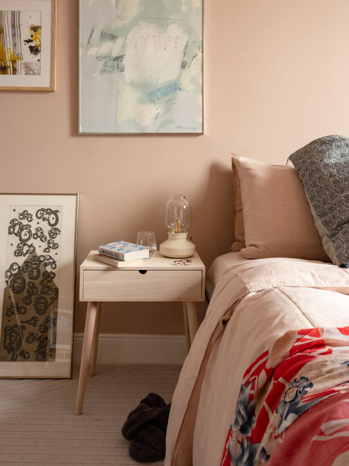 A Pink and Orange Bedroom in a Light Stockholm Apartment 19 bedroom nightstand
