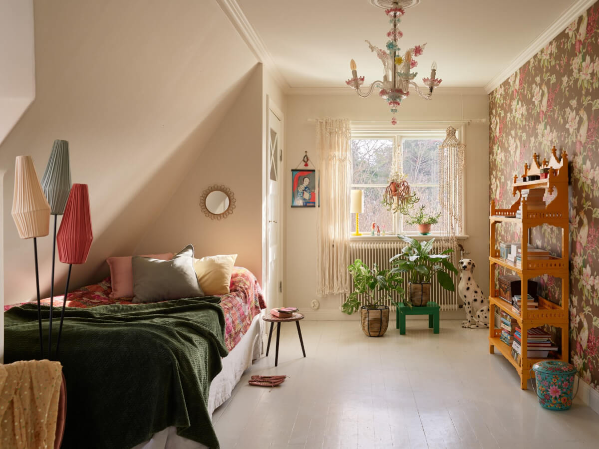 Colorful Interiors in a Wonderful Early 20th Century Swedish Villa 40 bedroom slanted ceiling white floorboards floral wallpaper
