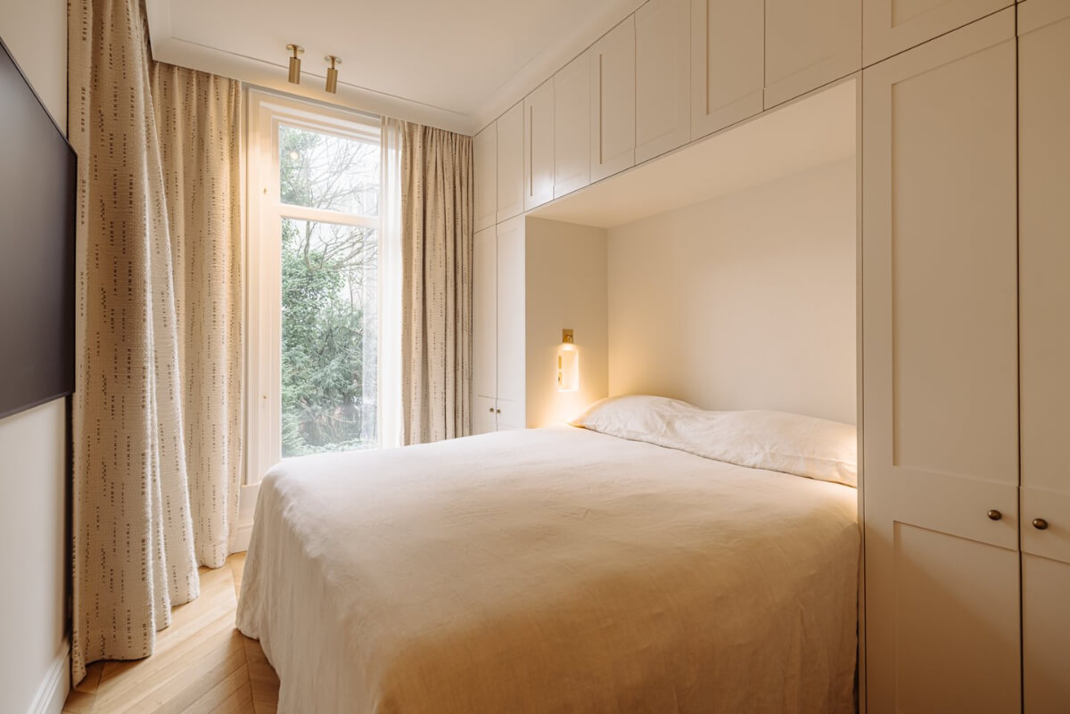 A Luxurious Apartment in Amsterdam with a Lovely Master Suite 18 bedroom wardrobes around bed