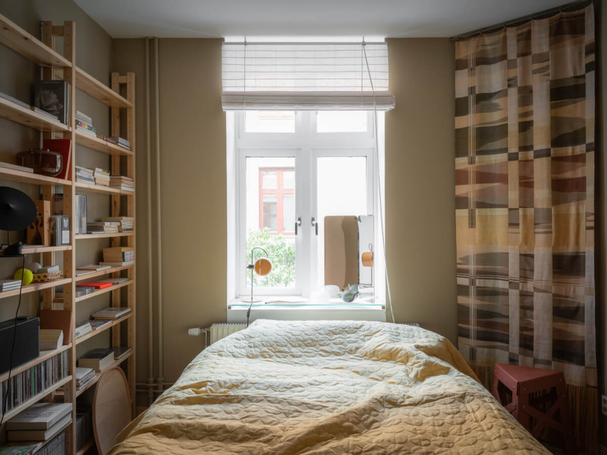 A Design Apartment in an Early 20th Century Building 24 bedroom with narrow bookshelves