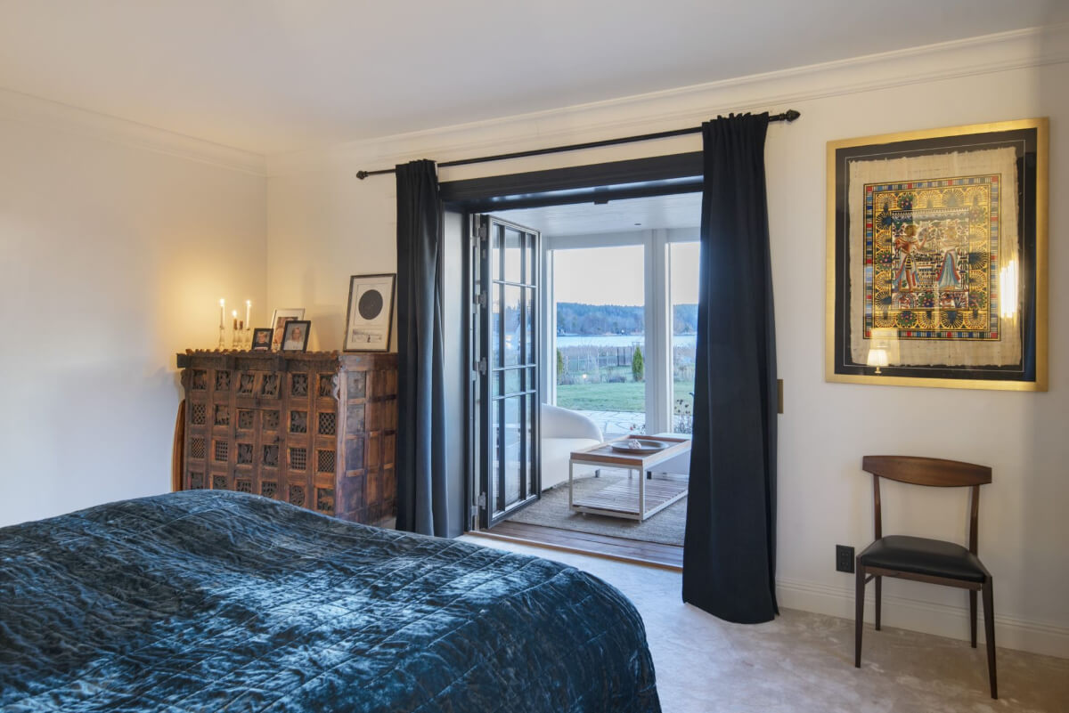 English Manor Style Interiors in a New Swedish Home with Lake Views 20 bedroom with terrace