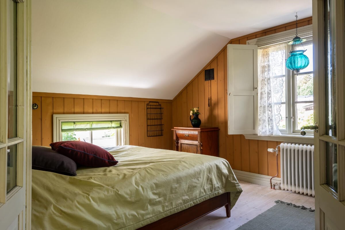 A Beautiful Historic Swedish Country House with Wallpapers 28 bedroom wood paneled walls wooden window shutters