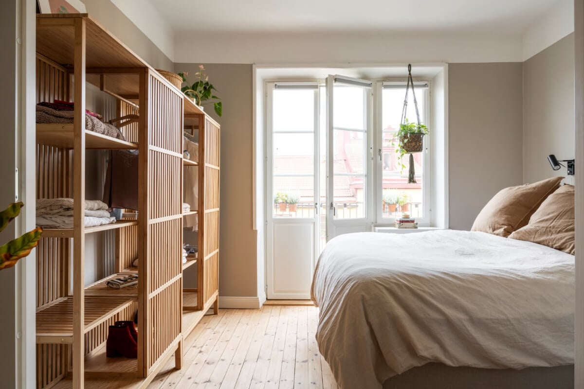 A Light Swedish Apartment with a Green Living Room 19 beige bedroom half open wardrobes