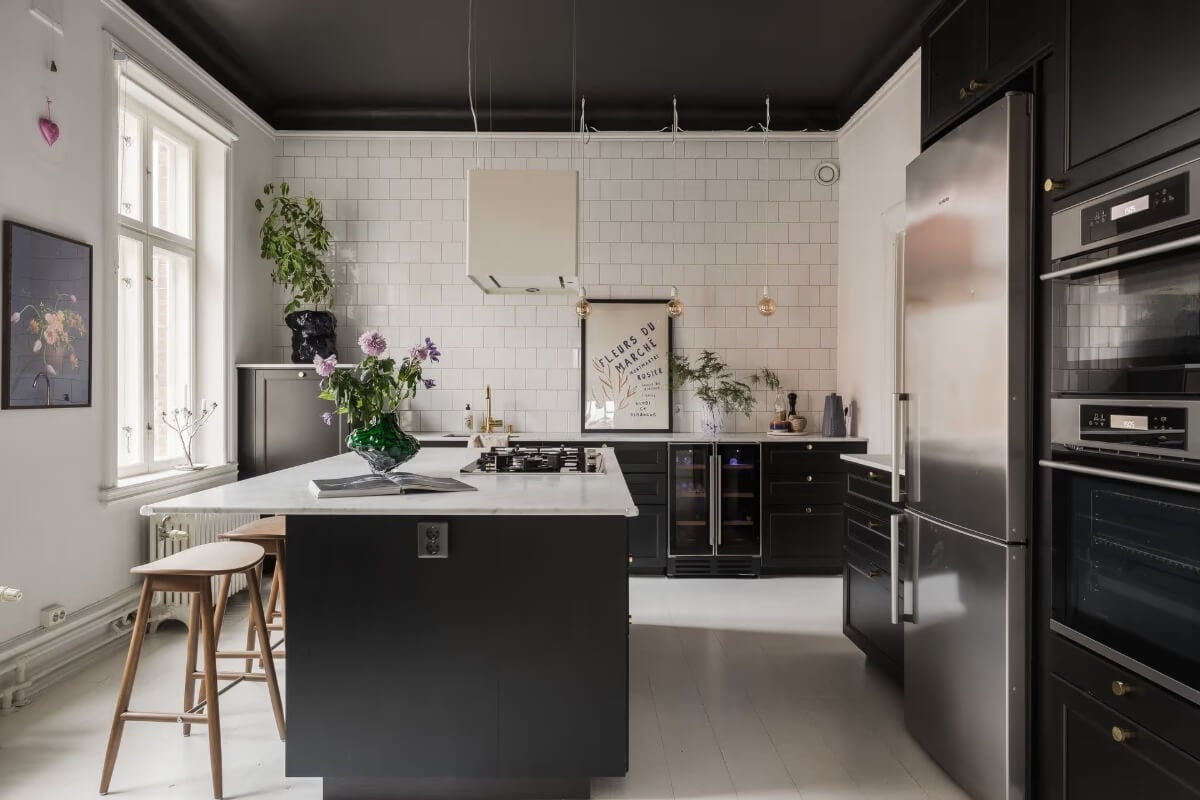 Grand Rooms and Period Features in a Malmö Apartment 12 black and white kitchen