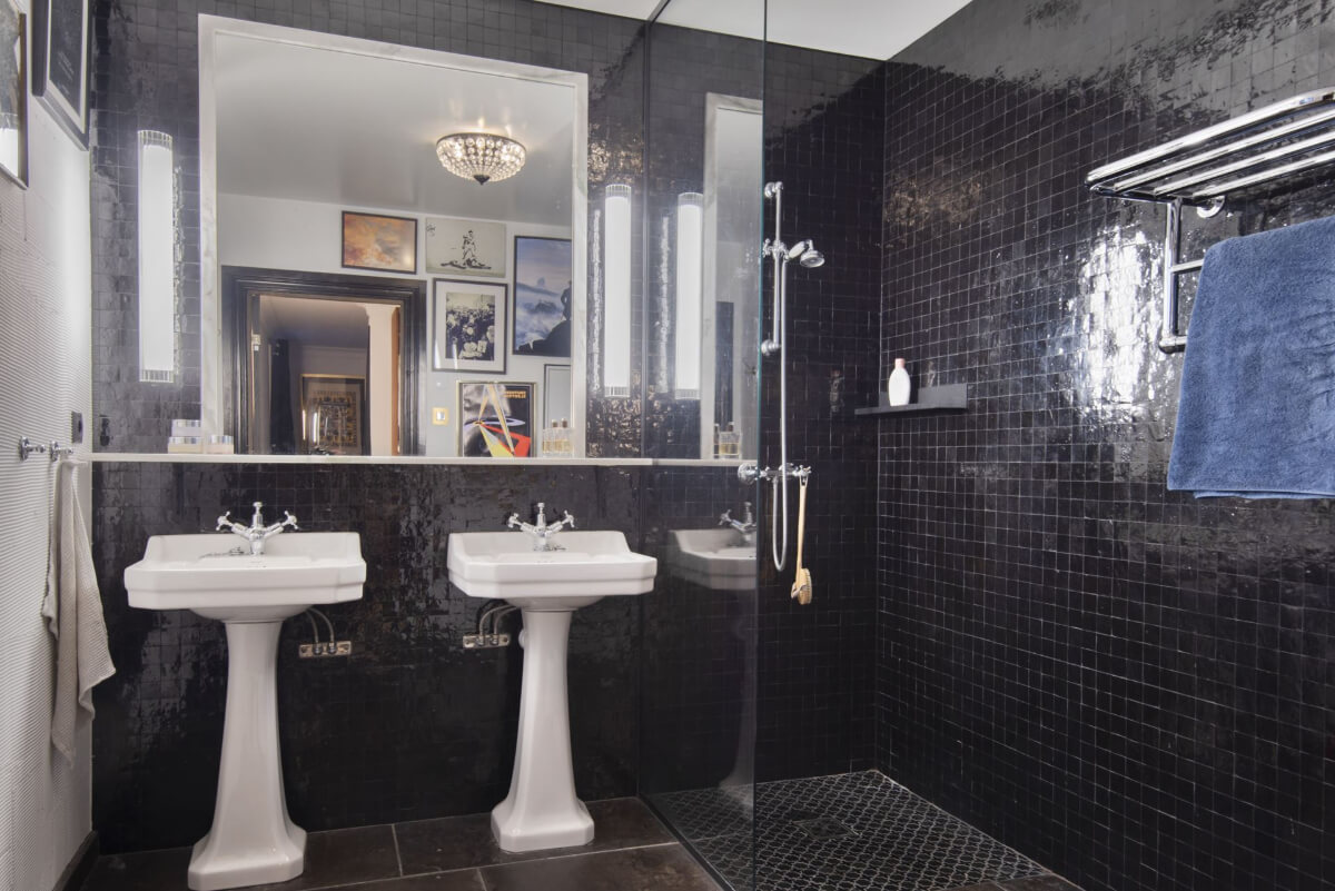 English Manor Style Interiors in a New Swedish Home with Lake Views 22 black bathroom double sinks