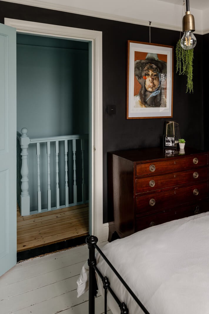 A Contrasting Color Palette in a Renovated Terrace House 13 black bedroom white floorboards